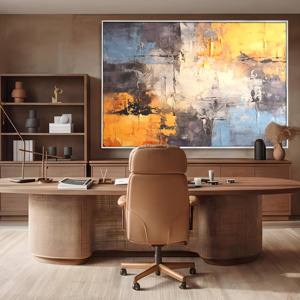 Tablou canvas cu pictura abstracta cu texturi portocalii si gri, in rama de aluminiu argintiu, pe perete intr-un birou